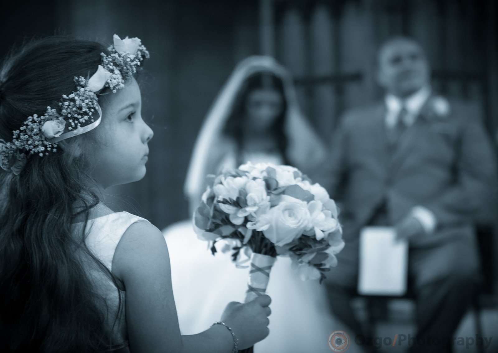 Ozgo Wedding Photography - Flower girl holding a bouquet during ceremony